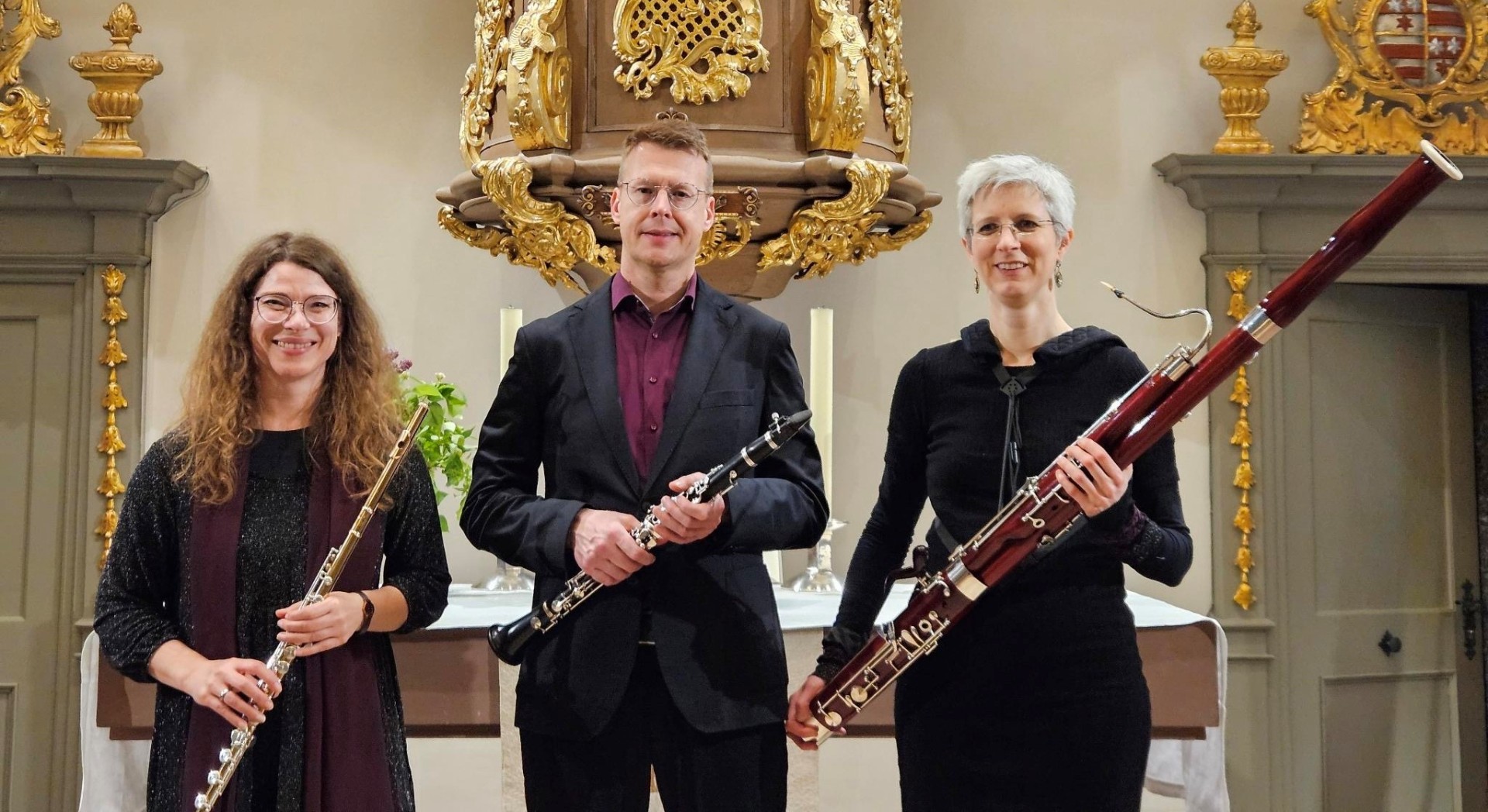 Foto: 3 MusikerInnen mit Instrumenten